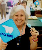 Olga Dicksom from el Cajon enjoys a popsicle provided by SDG&E at the kickoff of the Cool Zone program